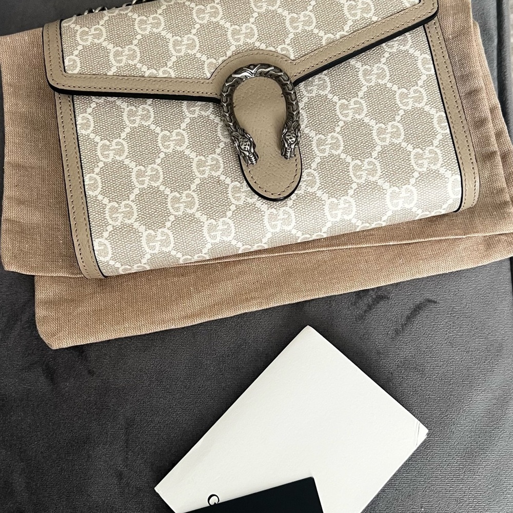 Unbranded monogram canvas leather wallet on the chain.